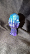 Blue and Purple Skull in Hand