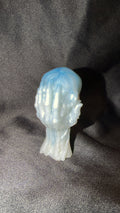 Blue and Pearl White Skull in Hand