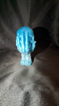 Baby Blue and Pearl White Skull in Hand