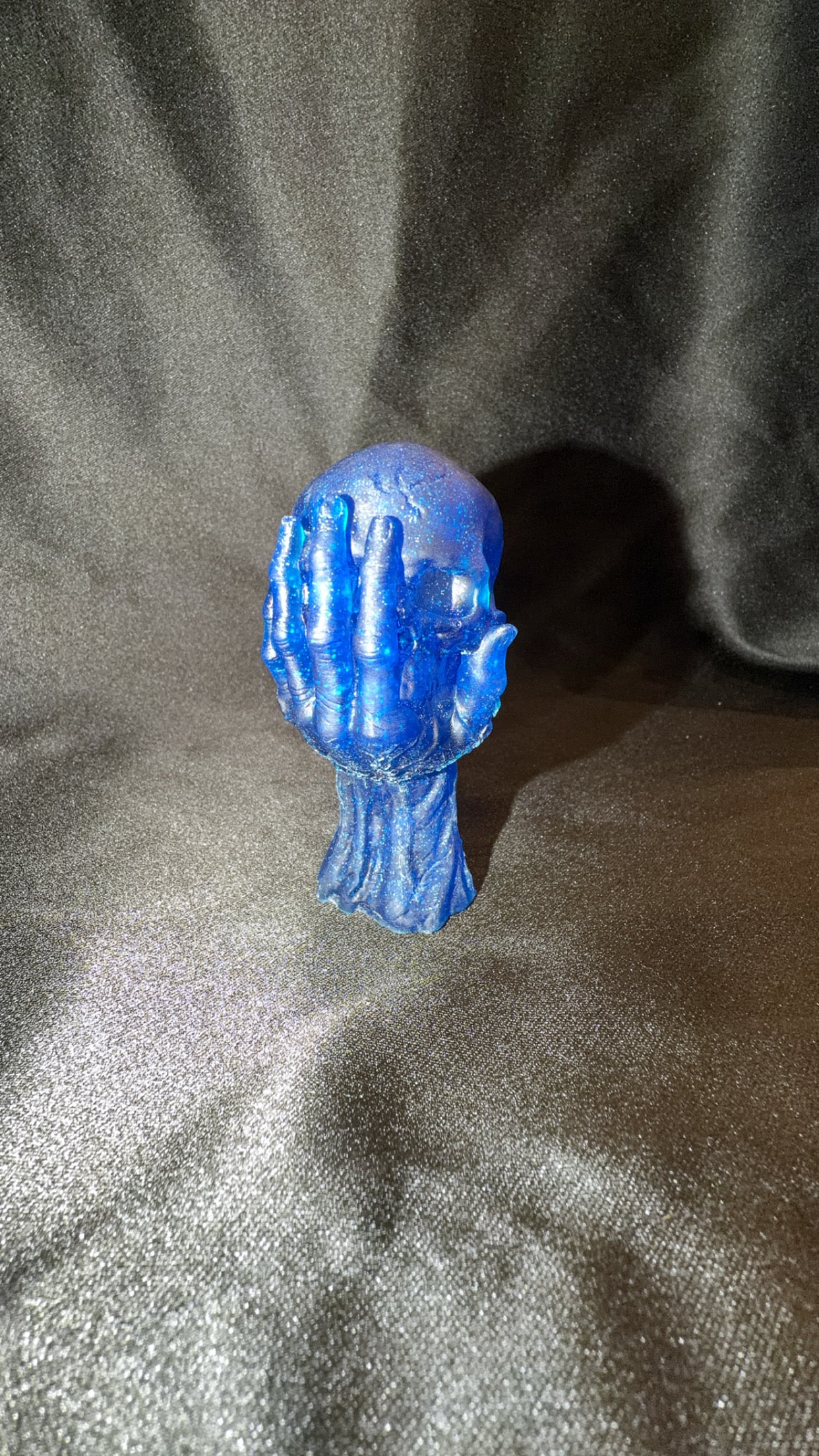 Dark Blue Skull in Hand